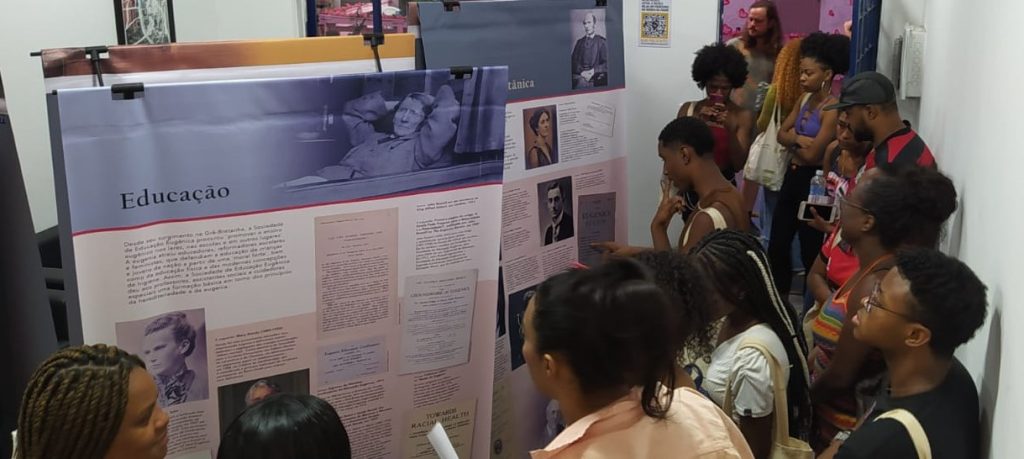 People reading exhibition panels