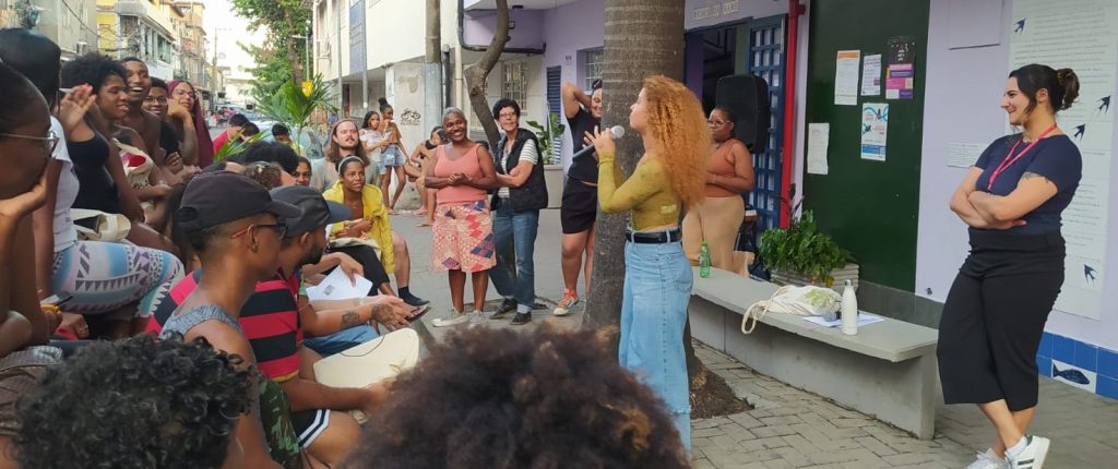Speaker and crowd outside exhibition