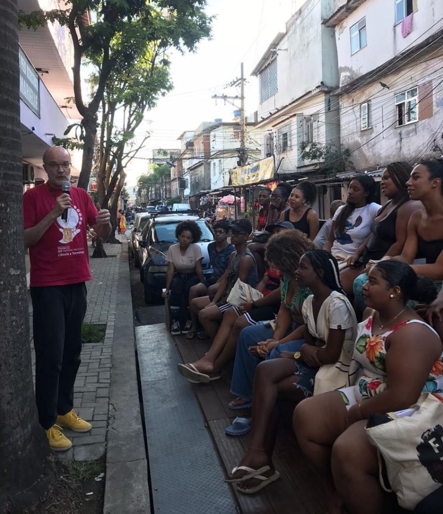 Speaker and crowd outside exhibition