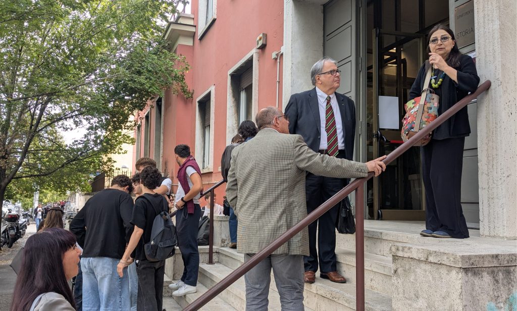 People waiting outside the We Are Not Alone exhibition at the Istituto di Storia della Medicina in Rome